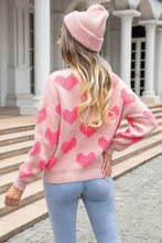 Cargar imagen en el visor de la galería, Suéter rosado oversized corazones Large
