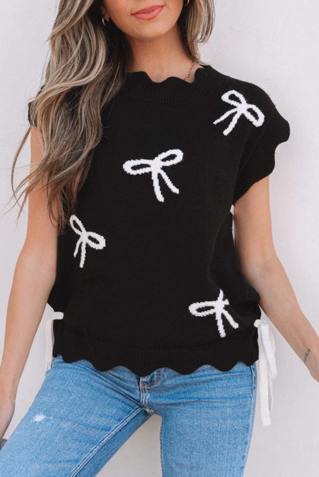 Blusa negra con moñitas S